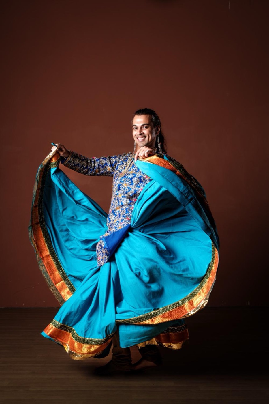 Swapnil Dagliya twirling a ghoomar skirt — Artistic Director of Shoonya Dance Centre